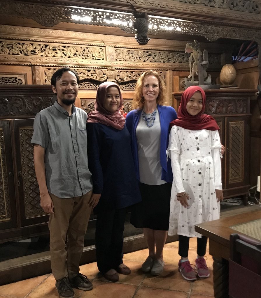 Photo of Teguh, Puji, Jayne, and Kapti out at welcome dinner